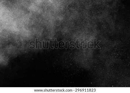 abstract white dust explosion  on black background.