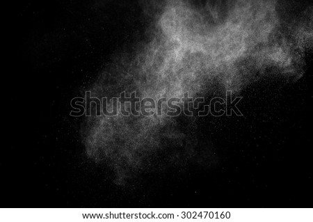 abstract white dust explosion  on a black background.