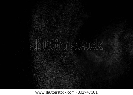 abstract white dust explosion  on a black background. 