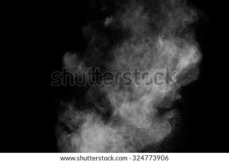 abstract white dust explosion  on a black background.