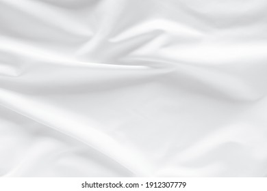 Abstract White Fabric Texture Background. Cloth Soft Wave. Creases Of Satin, Silk, And Cotton.
