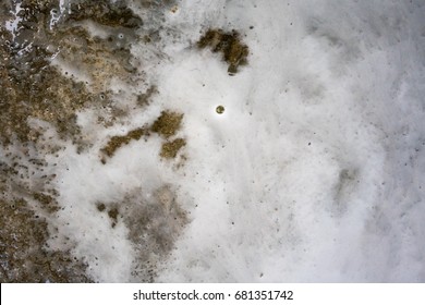 Abstract White Foam Flow With Water On Dirty Concrete Floor For Texture Background. Car Wash And Floor Cleaning In The Garage At Home