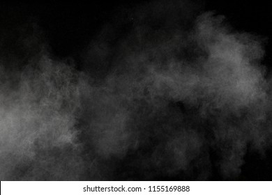 Abstract White Powder Explosion. White Dust Debris Isolated On Black Background.