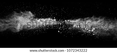 Abstract white powder explosion isolated on black background. High resolution texture