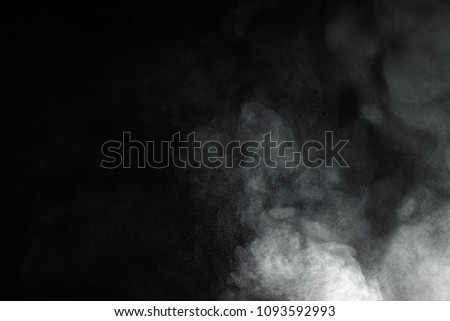 abstract white powder explosion on black background