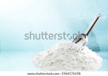 Abstract white powder in steel spoon