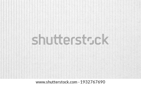 Abstract white recycled paper vertical lined texture background. 
Old Kraft box craft paper stripes pattern seamless. 
top view.