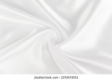 Abstract White Silk Fabric Texture Background. Cloth Soft Wave. Creases Of Satin