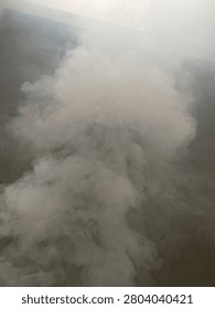 Abstract white smoke texture cloud on a grey background
Thick puff of white smoke or fog rising up against a dark moody background. Perfect overlay texture for creative designs, abstract concepts, or dramatic atmospheric effects