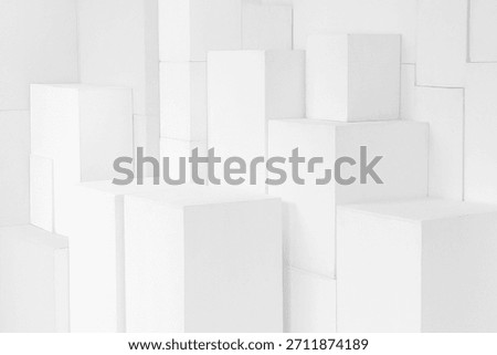 Abstract white stepped multilevel background. Snow-white cubes and parallelepipeds, a geometric maze on a white background, a sense of spatial depth.