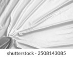 Abstract white wrinkled bedding sheet fabric texture background