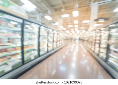 Abstract Wide Perspective View Of Huge Glass Door Aisle With Variety Pack Of Frozen Food. Prepared Meal, Fruit, Vegetable For Busy People Lifestyle.