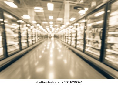 Abstract Wide Perspective View Of Huge Glass Door Aisle With Variety Pack Of Frozen Food. Prepared Meal, Fruit, Vegetable For Busy People Lifestyle.