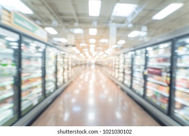 Abstract Wide Perspective View Of Huge Glass Door Aisle With Variety Pack Of Frozen Food. Prepared Meal, Fruit, Vegetable For Busy People Lifestyle.