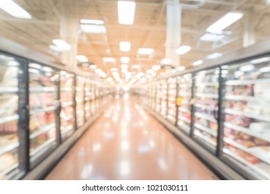 Abstract Wide Perspective View Of Huge Glass Door Aisle With Variety Pack Of Frozen Food. Prepared Meal, Fruit, Vegetable For Busy People Lifestyle.