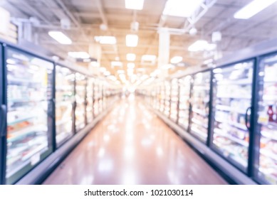 Abstract Wide Perspective View Of Huge Glass Door Aisle With Variety Pack Of Frozen Food. Prepared Meal, Fruit, Vegetable For Busy People Lifestyle. Vintage Tone