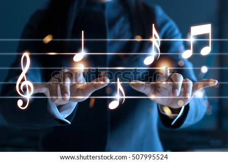 Abstract woman hands playing music notes on dark background, music concept