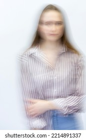 Abstract Woman Studio Portrait With Long Brown Hair In Motion Blur Effect Style And White Background. Model Wearing Jeans And Blouse With Stripes. Image Contain Grains And Noise