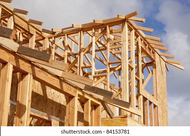 Abstract Of Wood Home Framing At Construction Site.