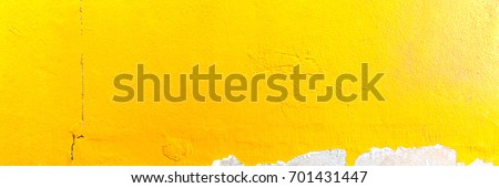Abstract yellow cement wall texture and background