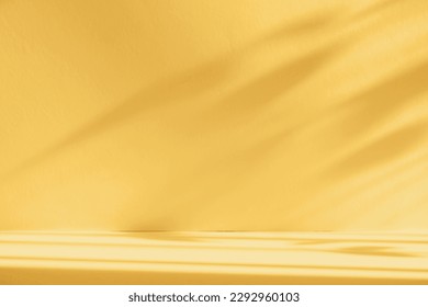 Abstract yellow color gradient studio background for product presentation. Empty room with shadows of window and flowers and palm leaves . 3d room with copy space. Summer concert. Blurred backdrop.