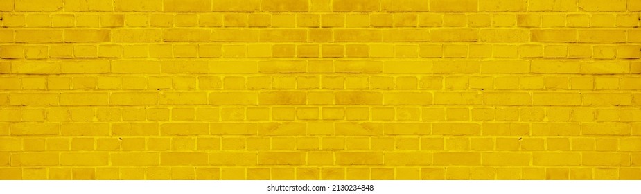Abstract yellow colored colorful painted damaged rustic brick wall brickwork stonework masonry texture background banner panorama pattern template architecture	