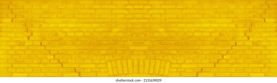 Abstract yellow colored painted damaged rustic brick wall brickwork stonework masonry texture background banner panorama pattern template architecture, with cracks