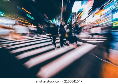 Abstract Zoom Blur Of Pedestrian Crossing Or Crosswalk In Shinjuku City During Evening Rush Hour With Many People Waiting To Cross. Urban Nightlife And Commuter Rushing Concept In Tokyo, Japan.