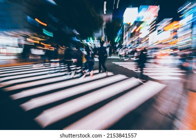 Abstract Zoom Blur Of Pedestrian Crossing Or Crosswalk In Shinjuku City During Evening Rush Hour With Many People Waiting To Cross. Urban Nightlife And Commuter Rushing Concept In Tokyo, Japan.