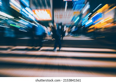 Abstract Zoom Blur Of Pedestrian Crossing Or Crosswalk In Shinjuku City During Evening Rush Hour With Many People Waiting To Cross. Urban Nightlife And Commuter Rushing Concept In Tokyo, Japan.