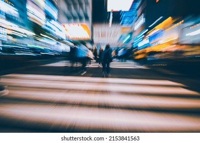 Abstract Zoom Blur Of Pedestrian Crossing Or Crosswalk In Shinjuku City During Evening Rush Hour With Many People Waiting To Cross. Urban Nightlife And Commuter Rushing Concept In Tokyo, Japan.