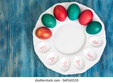 Abstraction painted Easter eggs on a blue background. Studio Photo