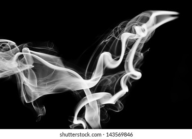 Abstraction: white smoke shape and swirls on black