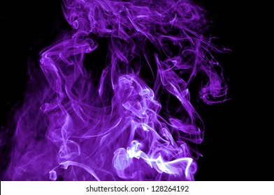Abstracts purple smoke on black background. Good for your design