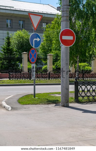 absurd, a contradiction of traffic\
signs on city streets. Errors of city symbols on the\
road