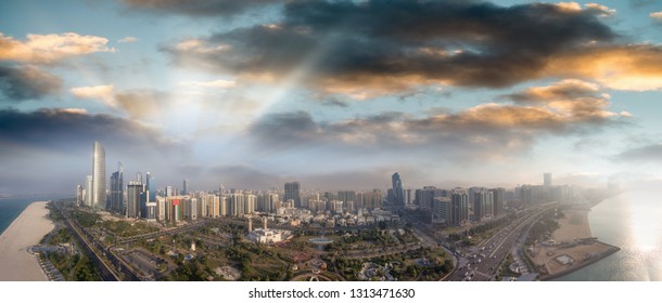 Abu Dhabi Aerial Skyline, Panoramic View From Drone At Dusk, UAE.