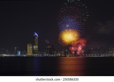 Abu Dhabi Skyline With Fireworks Lighting Up The Sky As Part Of The National Day Celebrations