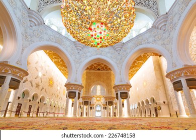 ABU DHABI, UAE - 26 MARCH 2014: Interior of Sheikh Zayed Grand Mosque in Abu Dhabi, United Arab Emirates. Mosque has many unique elements like 12 tons chandelier covered by gold and Swarovski crystals