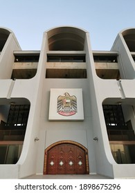 Abu Dhabi, UAE - Circa 2021. VIP Entrance Large Wooden Door And UAE Symbol Above It At The Sheikh Zayed Stadium