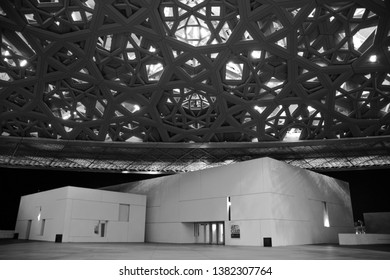Abu Dhabi, UAE - December 27, 2018: The Louvre Museum’s interior night-shot, showing the reflections of the ‘Rain of Light’ design structure. Art Club hall.