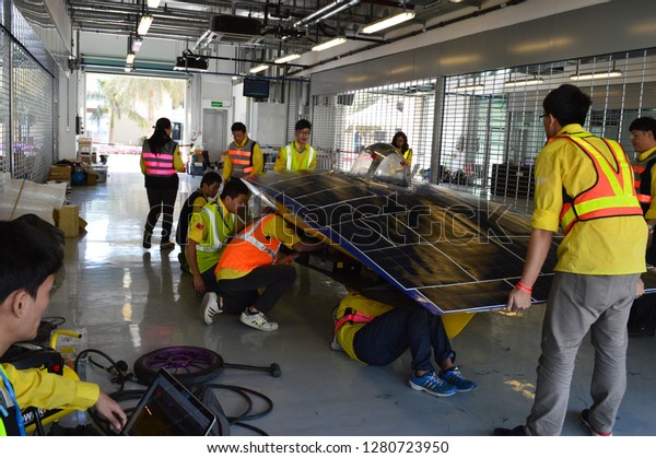 Abu\
Dhabi,  UAE- January 2017. Students assemble Solar powered car at\
Yas Circuit during World Future Energy Exhibition\
