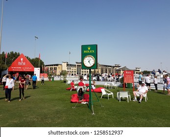 Abu Dhabi,  UAE- January 2018. Rolex Clock In The Middle Of HSBC Golf Event With Westin Hotel Seen Backside