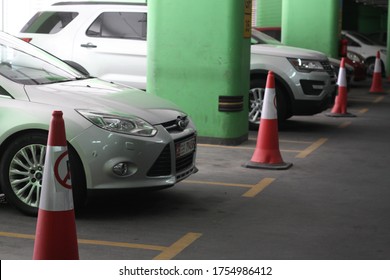 Abu Dhabi, UAE: June, 11, 2020, A Car Parking In Abu Dhabi, Where Every Public Place Has To Keep Social Distance, By Keeping One Parking Space Between Each Car, To Make That Real They Put Cones.