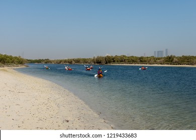 ABU DHABI, UAE - OCTOBER 10, 2014: Kayaking In Mangrove National Park, Abu Dhabi, United Arab Emirates. The Natural Mangrove Forests Are A Popular Playground For Outdoor Activities.