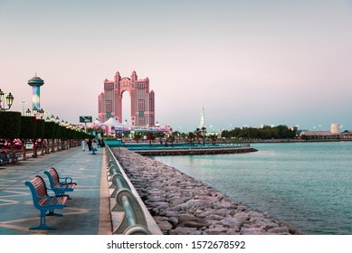 Abu Dhabi, United Arab Emirates - November 2, 2019: Al Marina island walking path by the seaside in Abu Dhabi at sunset