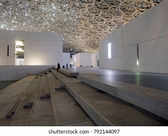 Abu Dhabi, United Arab Emirates - December 20, 2017: The Louvre Museum With Modern Design Exterior Luminated At Night 