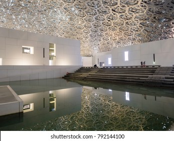 Abu Dhabi, United Arab Emirates - December 20, 2017: The Louvre Museum With Modern Design Exterior Luminated At Night 