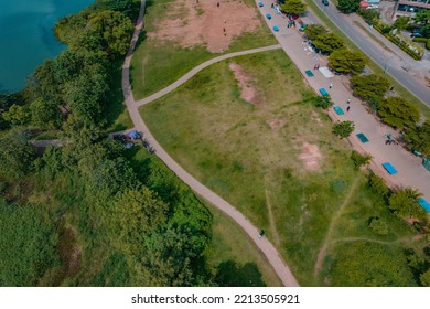 Abuja, Nigeria - October 12, 2022:  Establishment Drone Shot Of An African Housing Estate In A City Centre. Affordable Housing In Abuja, Nigeria Overlaps A Busy Highway. City View With Lake View.