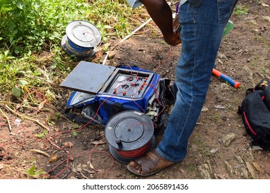 Abuja, Nigeria - October 28, 2021: African Geologist And Team Members Conducting Geophysical Survey For Water Availability In The Ground. Soil Science And Test. Rural Water Project.