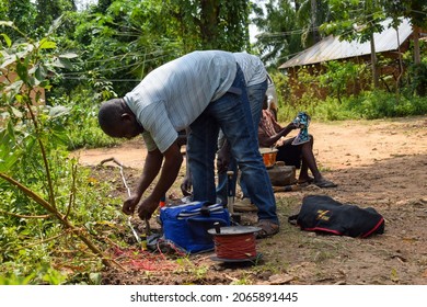 Abuja, Nigeria - October 28, 2021: African Geologist And Team Members Conducting Geophysical Survey For Water Availability In The Ground. Soil Science And Test. Rural Water Project.